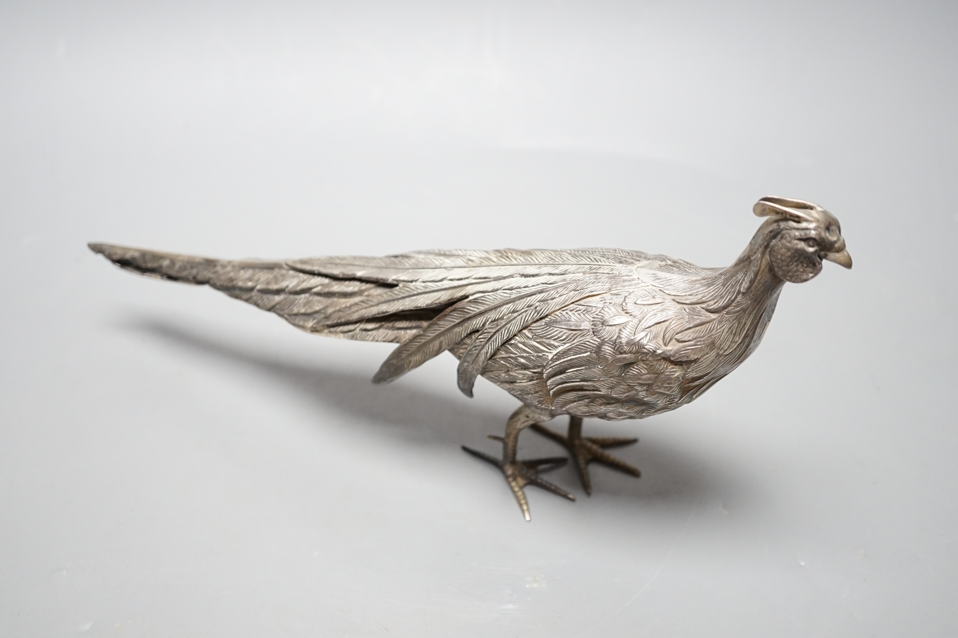 A 20th century Spanish white metal free-standing model of a pheasant, length 28.5cm, 148 grams.